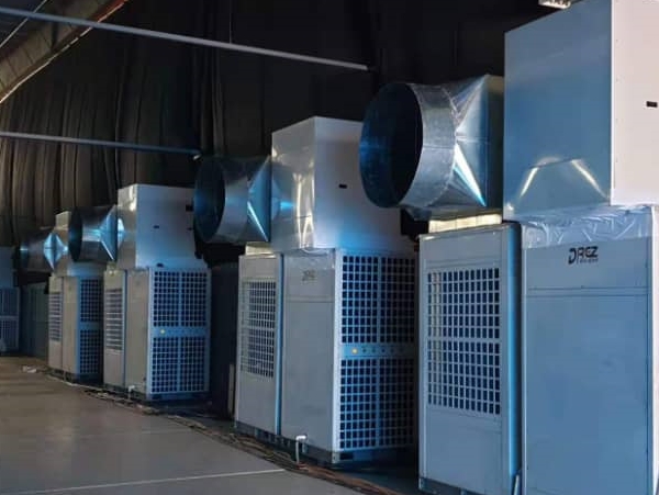 Commercial cooling units fitted with ductwork in a warehouse