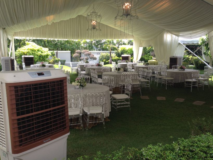 Portable air cooler at a furnished garden marquee
